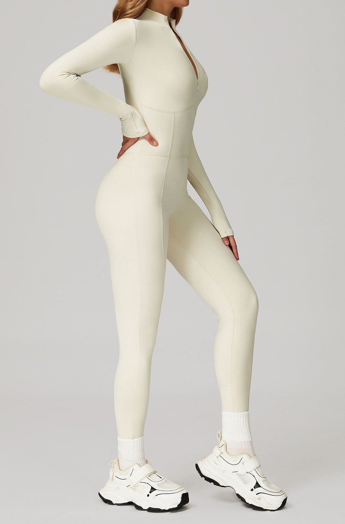 long-sleeve, zip-front activewear jumpsuit or unitard-beige